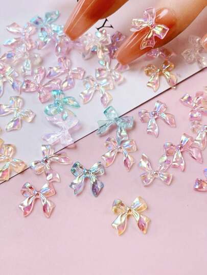 1 Bag Of 50Pcs 3D Aurora Bow Jewelry Resin Material Colorful Ribbon Tie Nails Art Decoration Personal Diy Nail Salon Nail Charms Nails Supplies Nail Gems