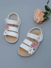 Nuovi sandali classici alla romana per bebè e ragazze, con fiore a sei petali in rilievo, disponibili in 3 colori, suola morbida antiscivolo con chiusura a strappo facile, sandali da principessa in pelle per prescolari. Nota: il motivo laterale sulla suola può variare leggermente tra le taglie [21-25, 26-29]