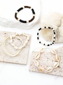 Set de 5 pulseras hechas a mano estilo playa trenzadas con conchas y caracolas con cuentas + pulsera de cuentas de madera en blanco y negro y conchas - Multicolor - Ver 4