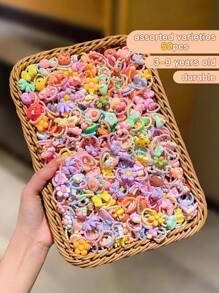 1 paquete de 50 piezas de Lazos de cabello en espirales de dibujos animados coloridos lindos al azar - Multicolor - Ver 12