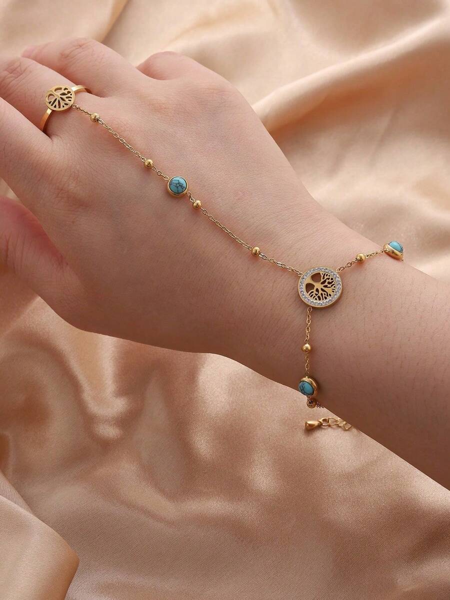 Ein stilvolles und vielseitiges Handschmuck aus Titanstahl mit einem Lebensbaum, besetzt mit blauem Türkis und künstlichem Zirkonia, für den täglichen Gebrauch der Damen.