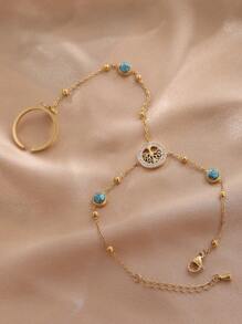 Ein stilvolles und vielseitiges Handschmuck aus Titanstahl mit einem Lebensbaum, besetzt mit blauem Türkis und künstlichem Zirkonia, für den täglichen Gebrauch der Damen.