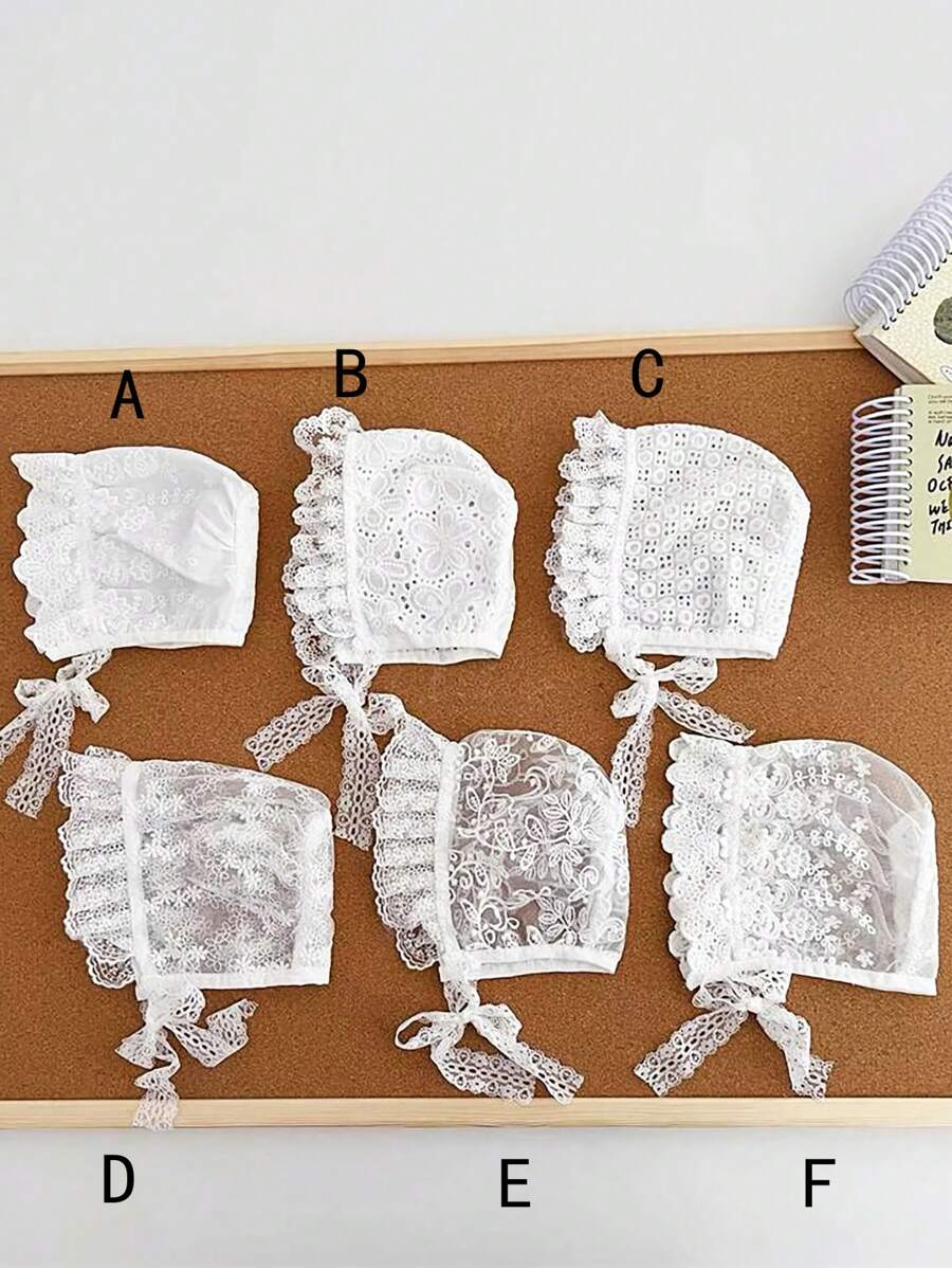 A White Palace-Style Baby Hat With Pointed Head And Lace Flower Retro Bonnet, Featuring Heavy Embroidery Decoration, Is Designed For A Baby Girl. Soft And Comfortable To Wear. It Is Also Known As A Fetal Hat, Newborn Hat, Warm Baby Cap, Cute Fetal Cap, Lace Baby Cap, Vintage Infant Hat, Exquisite Lace Bonnet, And Fashionable Baby Cap.