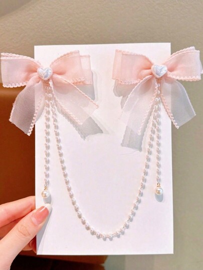 قطعة واحدة من مشبك شعر بشكل فتاة جميلة مزين باللؤلؤ والشرابة.نظرًا لاختلاف دفعات الأقمشة ، فإن الاختلاف البسيط في اللون أمر طبيعي. البطاقة الخاصة بالتعبئة والمنتج الفعلي هما السائدان. عدد اللؤلؤات عشوائي.