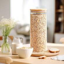 A Large Plastic Food Storage Container With A Sealed Wooden Lid, Used For Storing Pasta, Nuts, Flour. Ideal For Kitchen Organization And Storage In A Pantry With Glass Jars.