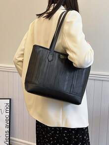 1個具有拉鍊和紋理設計的高容量手提袋，適合購物、約會和旅行，全年適用