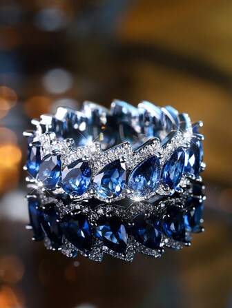 Un lujoso anillo de compromiso de gota de agua de circonita cúbica azul para mujeres, joyería de boda de verano de plata