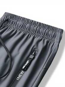 Pantalones de sudadera casuales y cómodos de verano para hombres con bolsillo con cremallera, cintura ajustable y detalles reflectantes, para entrenamiento