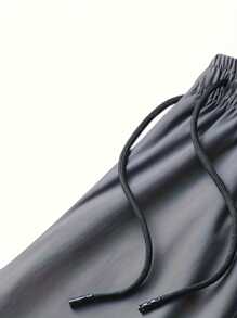 Pantalones de sudadera casuales y cómodos de verano para hombres con bolsillo con cremallera, cintura ajustable y detalles reflectantes, para entrenamiento