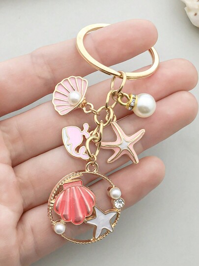 1 pièce Porte-clés de la collection océan avec coquillage, étoile de mer, dauphin et faux perle. Convient pour les sacs, les sacs à dos, les clés de voiture. Un cadeau pour les accessoires de voiture, les sacs, les amis. Perle