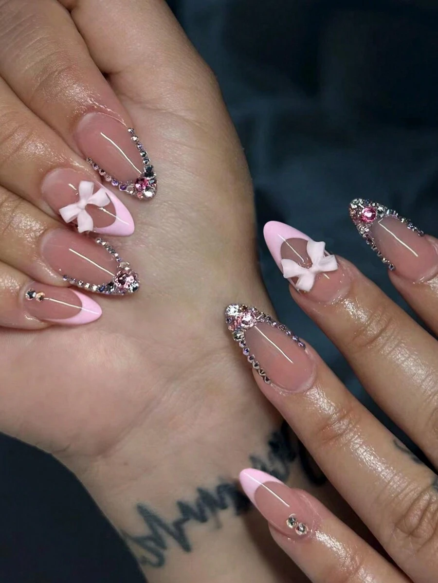 Ensemble de 24 pièces Tips d'ongles en amande français longs rose avec design de nœud papillon et strass, faux ongles en acrylique. Contient 1 pièce tube de gelée de colle et 1 pièce lime à ongles. Convient pour les femmes et les filles, la vie de tous les jours et les fournitures pour les ongles de fête. - Voir 1