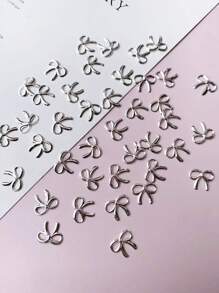 100个3D金属蝴蝶结美甲装饰品，可爱、清新、复古，适合DIY美甲沙龙，韩日风格美甲配件，镂空蝴蝶结美甲饰品，美甲装饰，美甲用品，美甲宝石 - 銀色 - 查看 4