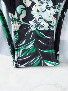 Fashionable Beachwear Monokini Solid Black Swimsuit With Printed Dress Hem And Slim Fit Design