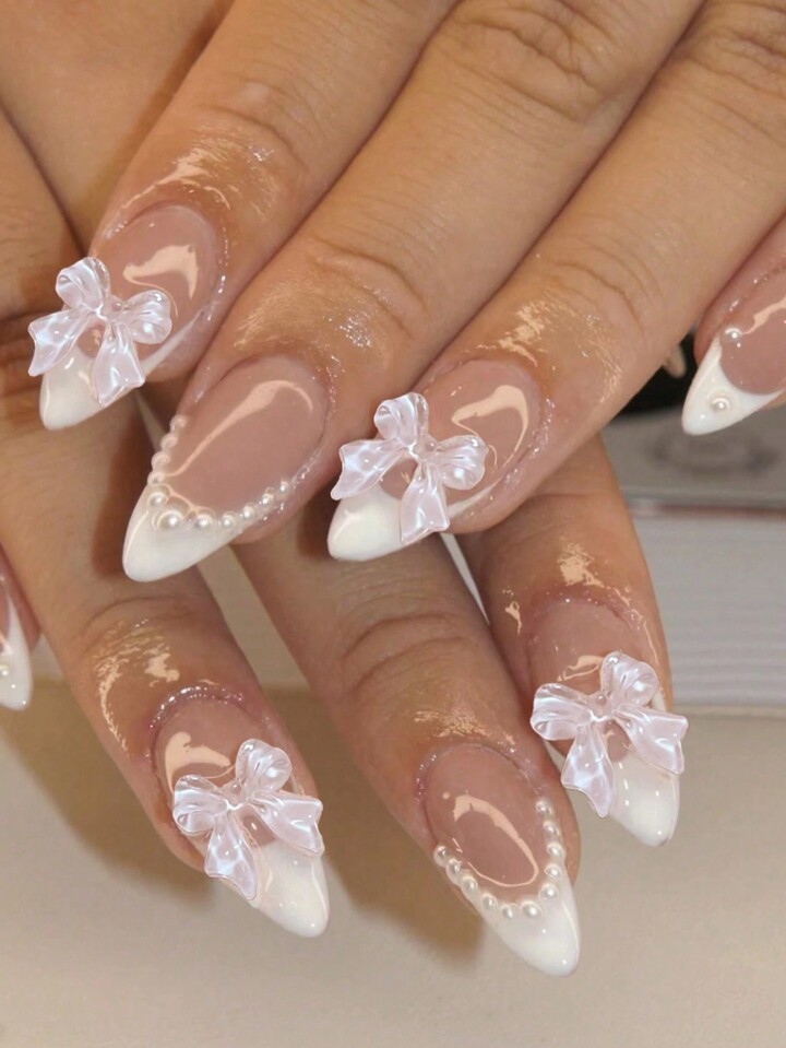 Using 24pcs French Long Almond Shaped Bowknot & Faux Pearl Design Artificial False Nail Set, Press-On Full Cover Nail Tips To Change Your Nail Style, Comes With 1pc Jelly Glue And 1pc Nail File, Great For Daily Wear For Women And Girls. Press On Nails Nail Supplies