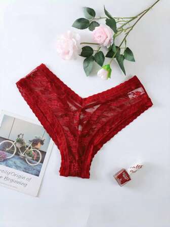 Tanga sexy de encaje de cintura baja con tirantes cruzados, respirable e invisible, de color rojo calado, con estilo lingerie europeo y americano, para Navidad