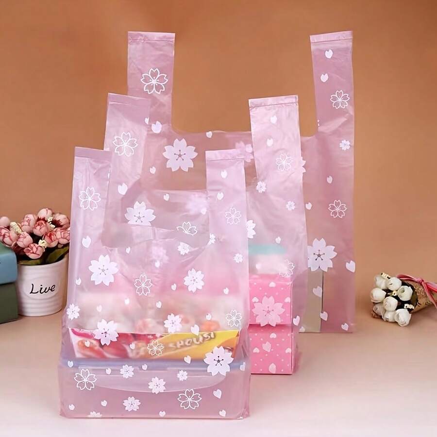 100入組超市購物粉色櫻花花背心塑料袋，適用於禮品、化妝品、食品和糖果包裝。這是一個便宜實用的物品，可用於購物、派對小禮物、婚禮和生日派對、手工藝品和禮品。 - 透櫻 - 查看 1