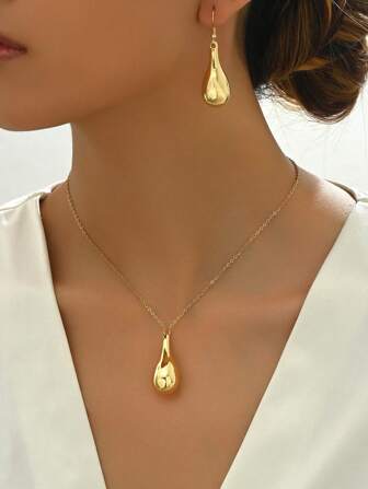 1 juego de aretes y collar minimalistas en forma de gota de agua ovalada con tono dorado, adecuados para uso diario por mujeres