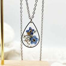 1 Vòng cổ vàng lấy cảm hứng từ thiên nhiên theo phong cách Bohemian với hoa khô thật bằng nhựa, có hoa cúc trắng và hoa cúc trắng, dây chuyền bằng thép không gỉ, một món quà tuyệt vời cho những người yêu thiên nhiên, hoàn hảo để mặc hàng ngày, bạn gái, sinh nhật, ngày của mẹ, giáo viên Ngày, v.v. Hoa Kỳ - dây chuyền hình giọt nước - Xem 6