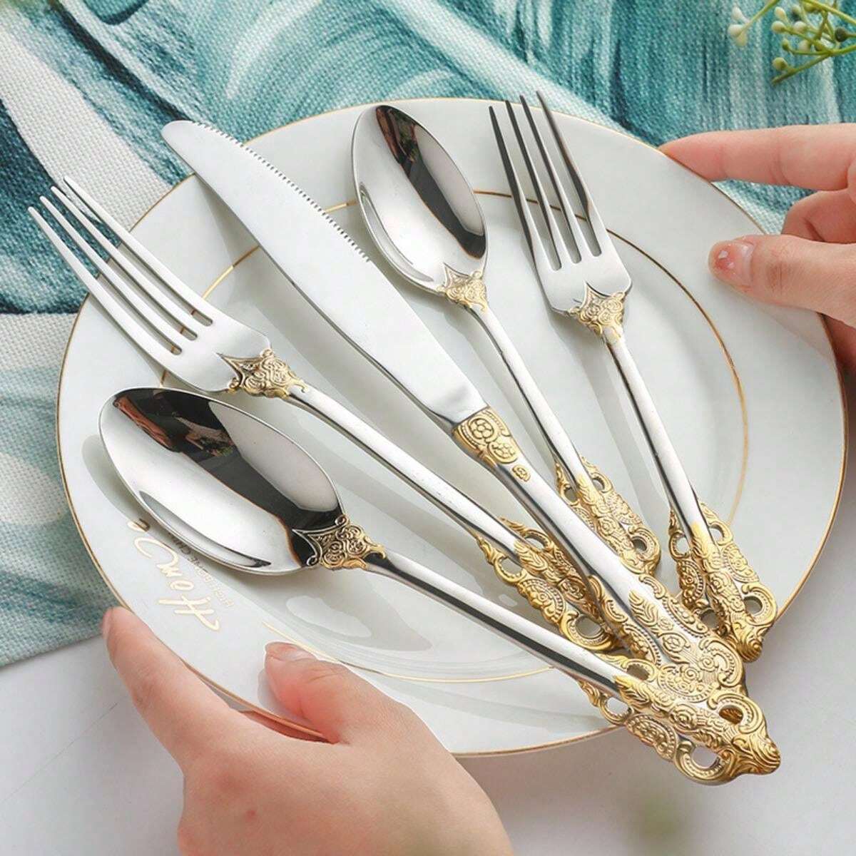 Stainless Steel Flatware Set With Gilt Relief Pattern, Including Knife