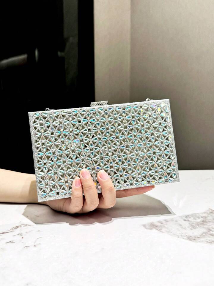 HCBCBY A Silver Holographic Dual Sided Rhinestone Encrusted Hollow Floral Decorated Box Shaped Clutch Bag With Metal Chain Strap For Evening Occasions Suitable For Parties Weddings Banquets Ball And G...