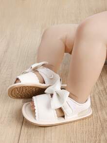 Sandali piatti in PU con fiocco a tinta unita per ragazze, suola in gomma antiscivolo, scarpe dolci e adorabili per principesse, adatte per primavera ed estate
