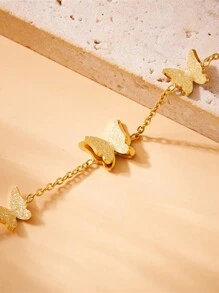 1 件镀金不锈钢链配蝴蝶和心形吊坠手链