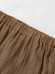 少女雙層蕾絲夏季無袖上衣搭配寬腿褲，休閒兩件套裝