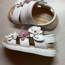 Nuovi sandali classici alla romana per bebè e ragazze, con fiore a sei petali in rilievo, disponibili in 3 colori, suola morbida antiscivolo con chiusura a strappo facile, sandali da principessa in pelle per prescolari. Nota: il motivo laterale sulla suola può variare leggermente tra le taglie [21-25, 26-29]
