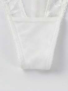 Conjunto de lencería con sujetador y pantalla decorativo de encaje blanco y sexy para mujer