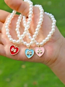1 pieza de pulsera elástica con bolita de perlas blancas elegante y colgante de dije de corazón y lazo de moda - Regalo perfecto para chicas - Pulsera de perlas con lazo - Ver 7
