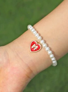 1 pieza de pulsera elástica con bolita de perlas blancas elegante y colgante de dije de corazón y lazo de moda - Regalo perfecto para chicas - Pulsera de perlas con lazo - Ver 4