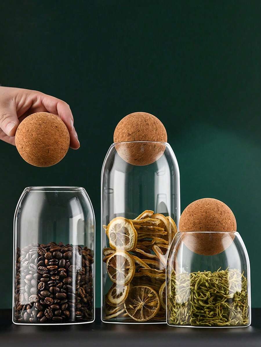 1 个带盖玻璃储物罐，用于存放谷物、茶叶等。返回学校