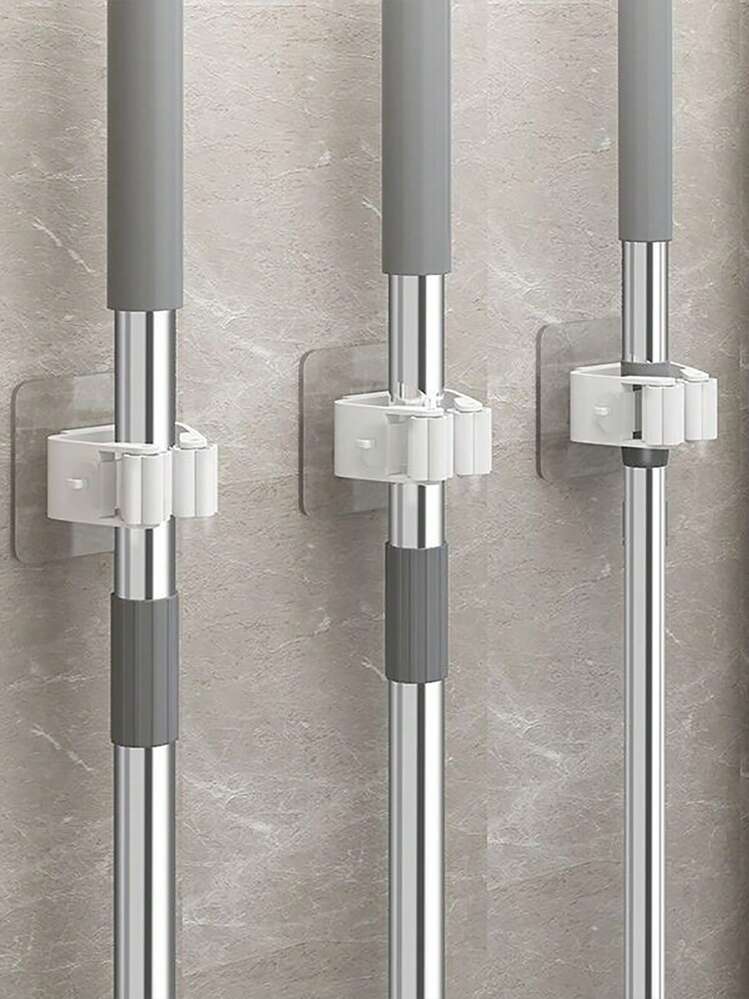 4 قطع من معلقات المكانس عالية القوة المتعددة الوظائف بدون ثقب للتركيب على الحائط، رف تخزين المجوزة مقاوم للماء، معلق للفرشاة، مُشبك لتخزين أدوات الحمام، خطاف للحمام، إكسسوارات حمام، مناسبة لوضع المكنسة والفرشاة وأدوات التنظيف في الحمام والحقيبة والمنظم والتخزين والمطبخ - أبيض - مشاهدة 2