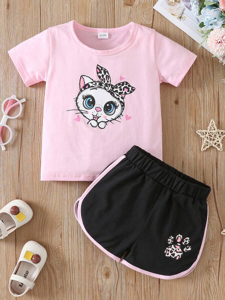 Conjunto casual de verano de 2 piezas para niñas jóvenes (de 1 a 6 años) con camiseta de manga corta linda con impresión de ojos grandes de gato y pantalones cortos con huellas de patas de gato - Rosa - Ver 1