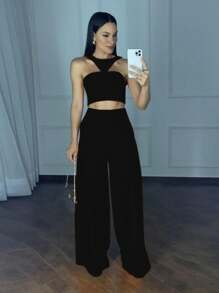 Conjunto pantalón pierna ancha y crop top tipo halter - Negro - Ver 1