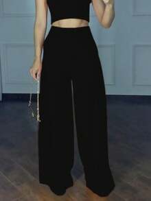 Conjunto pantalón pierna ancha y crop top tipo halter - Negro - Ver 3