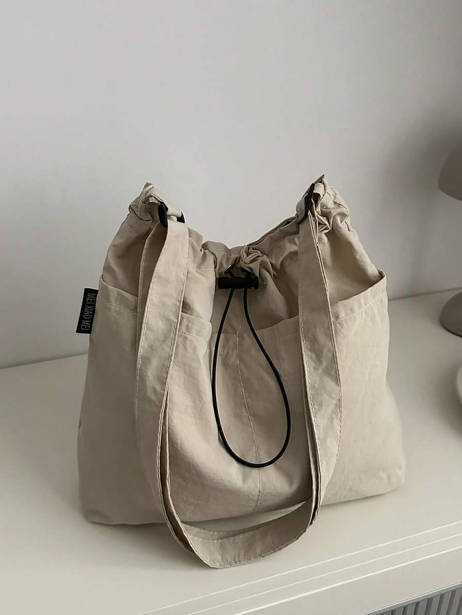 Geantă din material lejeră, de mare capacitate, elegantă, cu închidere cu șnur, curea lată și design de toc pentru școală, navetă și cumpărături