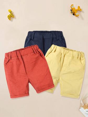 Young Boy 2025 Summer New 3-pack enfärgade sportshorts, röd + gul + marinblå, barn pojkar hem fritidsresor knälånga shorts