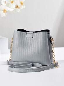 Nova bolsa balde de grande capacidade 2024, bolsa feminina versátil para deslocamento, transversal, pequena, bolsa listrada simples, com corrente, pingente decorativo, bolsa feminina de volta ao trabalho, os melhores presentes de Dia das Mães de todos os tempos