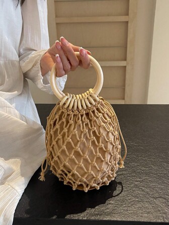 Bolso de mano redondo tejido y hueco, estilo minimalista