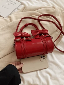 حقيبة يد دائرية خفيفة ومميزة بتصميم صيفي أحمر بالعقدة الزخرفية، مناسبة للفتيات الصغيرات للسفر والحفلات