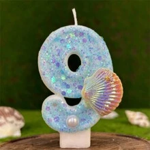 Bougie d'anniversaire créative avec perles fausses en coquille, motif océan bleu. Décoration de gâteau étincelante pour créer une atmosphère festive significative pour anniversaire, Noël