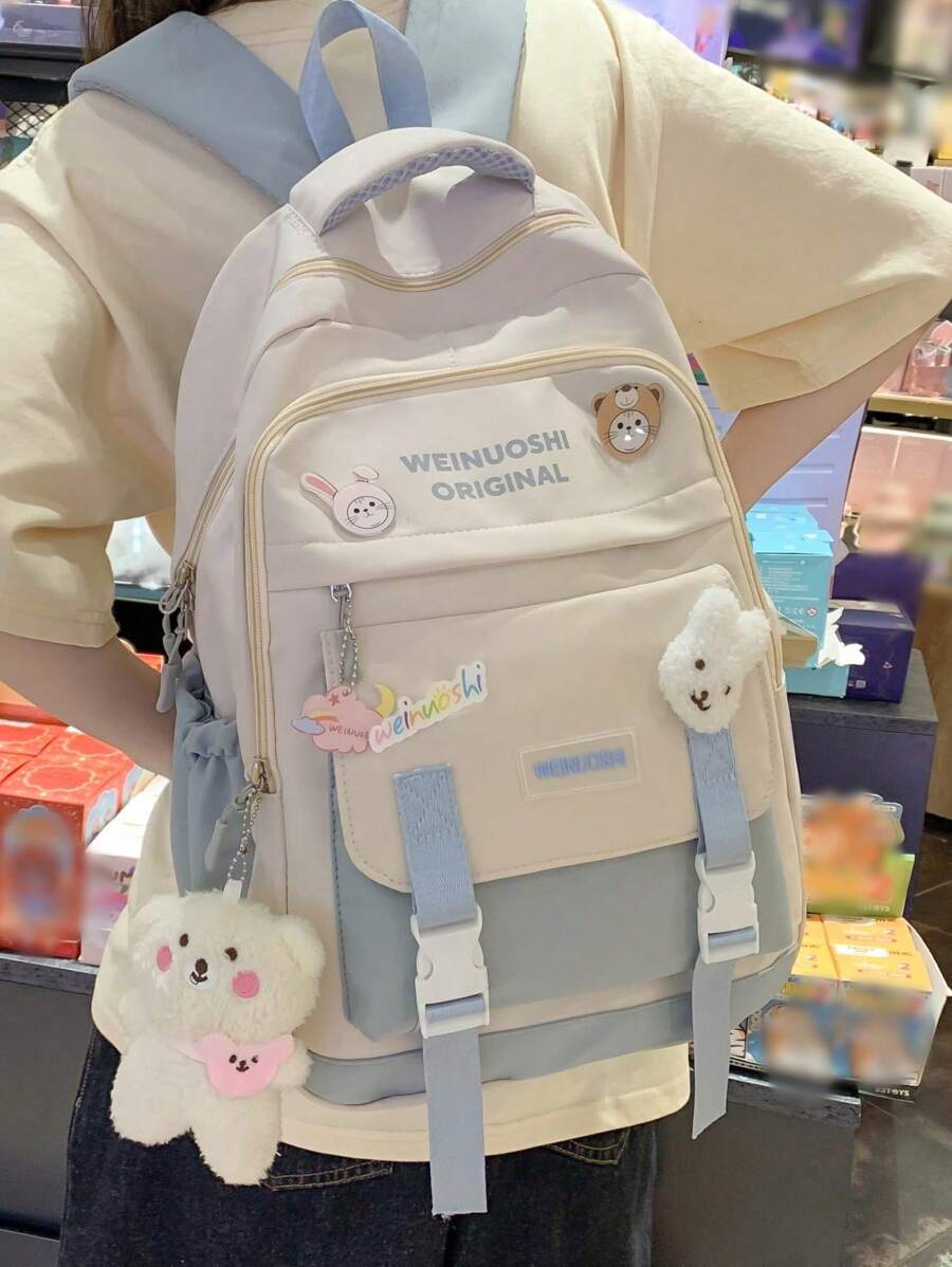 字母图案经典背包，饰有卡通吊坠和学校风格徽章，适合上学、返校季、用作笔记本电脑包和电脑包，以及其他返校用品。 - 藍色 - 查看 1