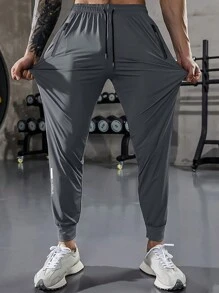 Pantaloni sportivi con vita elastica, coulisse e tasche con cerniera, in tinta unita, adatti per esercizio, fitness, escursionismo, corsa e uso casual