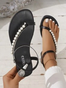Sandalias planas de mujer en forma de T, estilo romano con decoración de cadena de perlas, cómoda sandalia abierta de punta para la playa con correa elástica en el talón, zapatos deslizantes de moda para el verano, negros - Negro - Ver 1