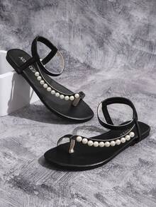 Sandalias planas de mujer en forma de T, estilo romano con decoración de cadena de perlas, cómoda sandalia abierta de punta para la playa con correa elástica en el talón, zapatos deslizantes de moda para el verano, negros - Negro - Ver 8