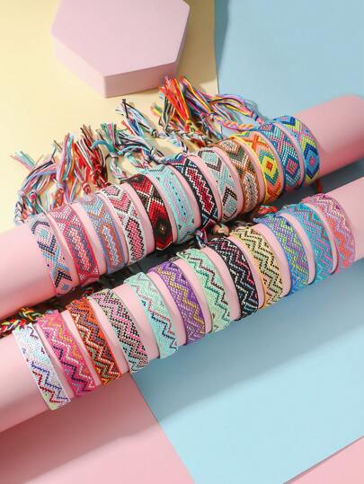 12入組彩色手工編織調節手鐲，帶箭頭和波紋設計