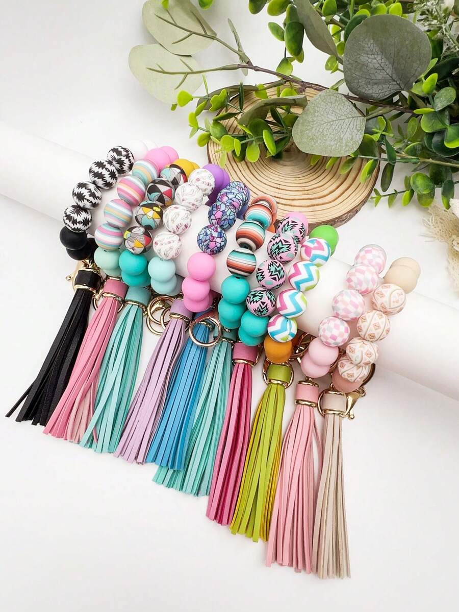 1个波西米亚风印花硅胶珠流苏挂件钥匙扣，可挂在包包上，防丢，是送给朋友、汽车配件、包包挂饰、背包挂件、学生礼物的理想之选。可爱哥特风Y2K风格挂绳，带证件夹，是圣诞节送给老师、姐妹的礼物创意。 - 彩色 - 查看 1