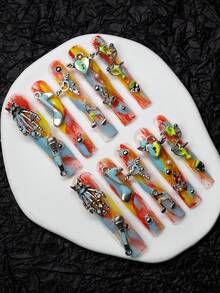 超长水管形手工 A 型按压式指甲，适合 Y2K 风格，多色手绘 A 型板饰有骷髅、金属骷髅手、麦克风、音符、心形锁、金属星星、蝴蝶结、心形翅膀钥匙和其他手工配饰设计，女士和女孩均可佩戴光面按压式指甲板，3 种尺寸，10 件/套，适合派对、音乐节、万圣节、日常穿着，包括工具包。 - 藍色 - 查看 3