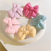 采用 ABS 材质的马卡龙蝴蝶结手机支架，防水，适用于智能手机的多功能支架，彩色哑光桌面支架